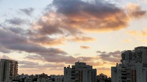 View from the window. The city at sunset 库存照片