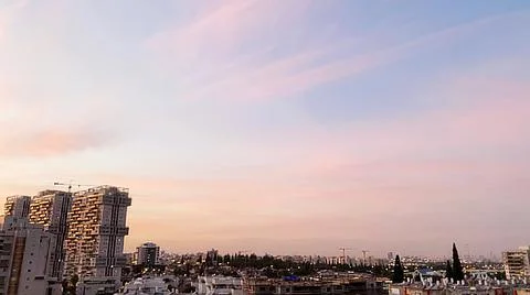 View from the window. The city at sunset 库存照片