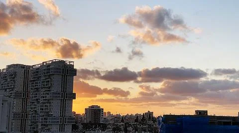 View from the window. The city at sunset Stock Photos