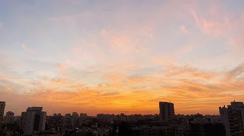 View from the window. The city at sunset 库存照片