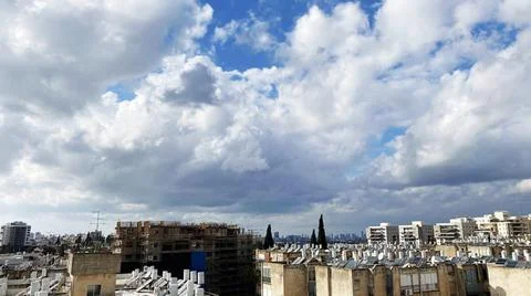 View from the window. City view over blue sky and white clouds Stock-Fotos