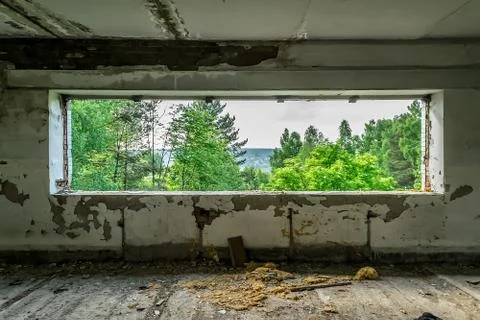 View from the window of the destroyed abandoned building on the street Stock Photos