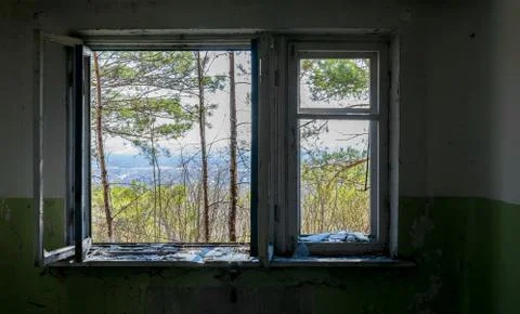 View from the window of the destroyed abandoned building on the street Stock Photos