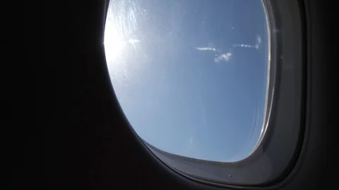 View from the window during the flight on a plane to the Sunny blue sky. Stock Footage 112590711