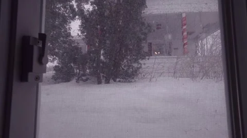 View from window during heavy snowfall in winter city Stock Footage 326377975