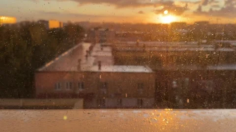 View from a window during a sunset and rain Stock Footage 314464779