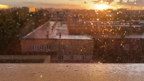 View from a window during a sunset and rain Stock Footage 314464780