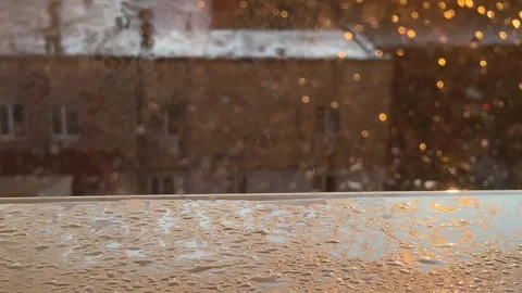 View from a window during a sunset and rain Stock Footage 314465293