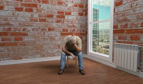 The view from the window of an empty room. The man is sitting on a stool. Stock Photos
