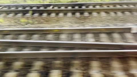 View from the window of fast moving train looking down at parallel railway track Stock Footage 338131096