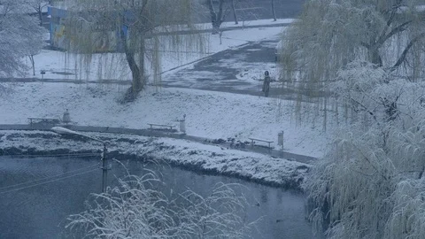 View from the window. First snow or snow in spring Stock Footage 127344419