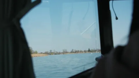 View from a window on the floating boat in the river in spring Vidéo 105882526