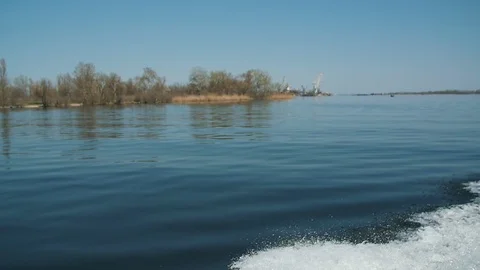 View from a window on the floating boat in the river in spring. Red buoy in the Video stock 105882586