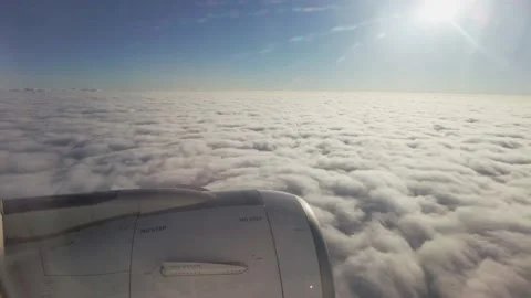 View from the window of a flying passenger plane above the clouds. Stock Footage 166458929