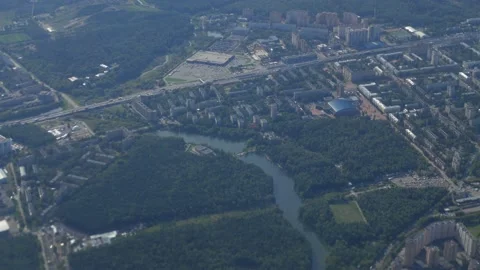 View from the window of a flying plane on a modern cityscape Stock Footage 140752877