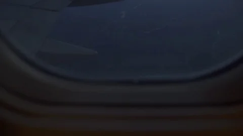 View from the window of a flying plane, at night Stock Footage 75774872