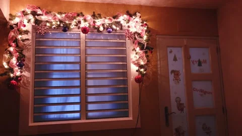 View of Window Frame at Night with Christmas Decorations Stock Footage 222023061