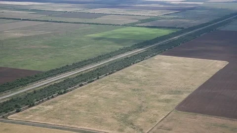 View from the window of a helicopter flying over a beautiful landscape on a b 動画素材 157231421