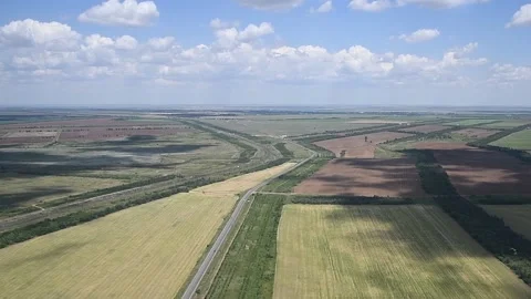 View from the window of a helicopter flying over a beautiful landscape on a b Stock Footage 211166407