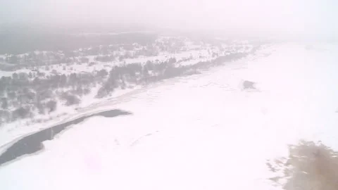 View from the window of a helicopter over the village of Luza in winter Stock Footage 88692933