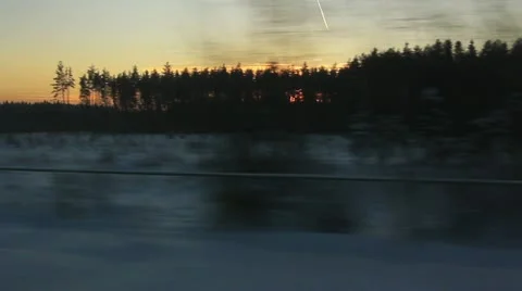 View from the window of high-speed train to Forest at sunset Stock Footage 20474893