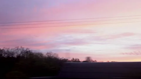 View from window of high-speed train on landscape of beautiful nature field road Video stock 155997884