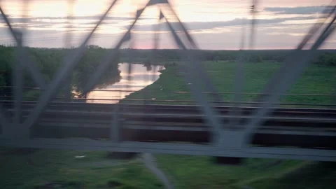 View from window of high-speed train on landscape of beautiful nature field Stock Footage 155997929