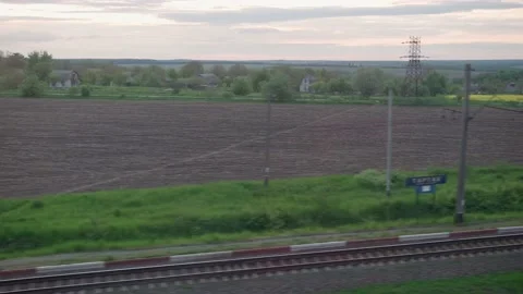View from window of high-speed train on landscape of beautiful nature field Stock Footage 155997991