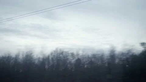 View from window of high-speed train on landscape of beautiful nature field road Stock Footage 156007669