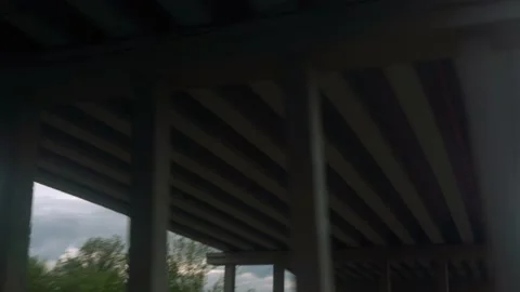 View from window of high-speed train with glare on glass passing under bridge on Stock Footage 156024087