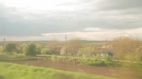 View from window of high-speed train on landscape of beautiful nature wild field Stock-Footage 156063922