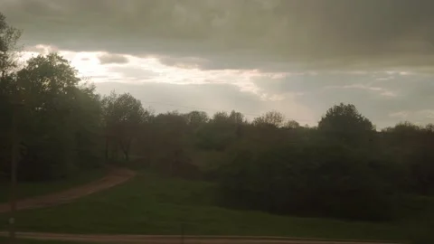 View from window of high-speed train on landscape of beautiful nature field road Stock Footage 156233901