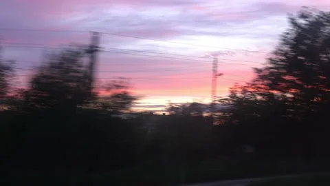 View from window of high-speed train on landscape of beautiful nature field road Stock Footage 156277671