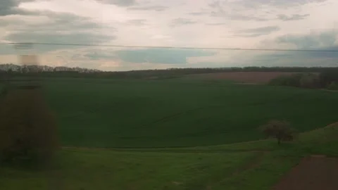 View from window of high-speed train on landscape of beautiful nature green Stock Footage 156366507