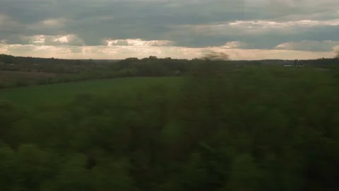 View from window of high-speed train on landscape of beautiful nature green Stock Footage 156381039