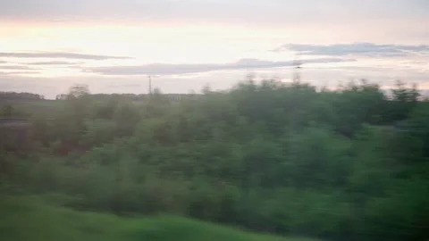 View from window of high-speed train on landscape of beautiful nature field Stock Footage 156442916