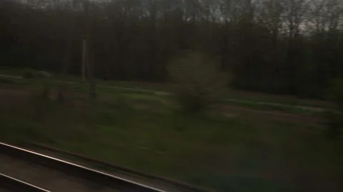 View from window of high-speed train on landscape of beautiful nature field Stock Footage 156483045