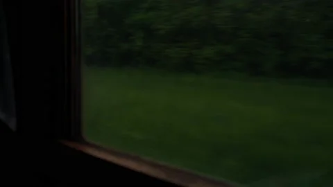 View from window of high-speed train on landscape of beautiful nature field road Video stock 156483050