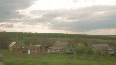 View from window of high-speed train on landscape of beautiful nature field road Stock Footage 156821310