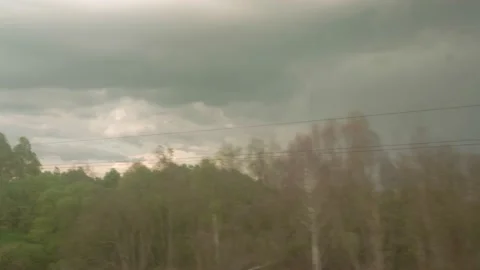 View from window of high-speed train on landscape of beautiful nature wild field Stock Footage 157336058