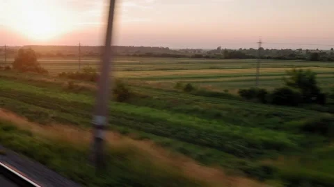 View from window high-speed train on landscape of beautiful nature wild field Stock Footage 157533740