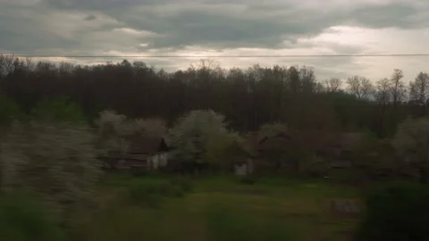 View from window of high-speed train on landscape of beautiful nature field Stock Footage 157698169