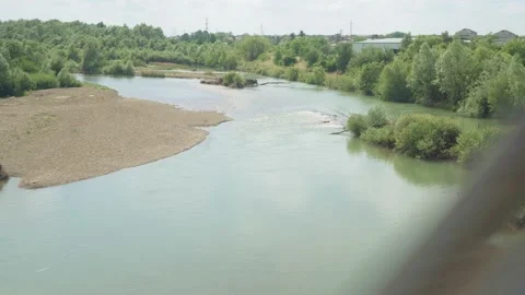 View from window high-speed train on landscape of beautiful nature river from Stock Footage 157737306