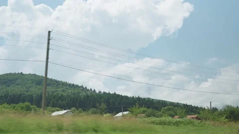View from window of high-speed train on landscape of beautiful nature wild field Stock Footage 157737339