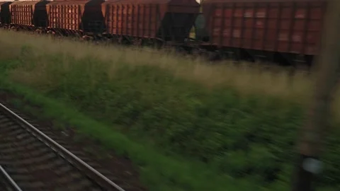 View from window high-speed train on old abandoned station and rusty freight Stock Footage 157889264
