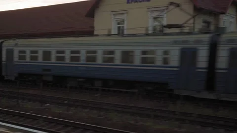 View from window high-speed train on old abandoned station and rusty freight Video stock 159168927