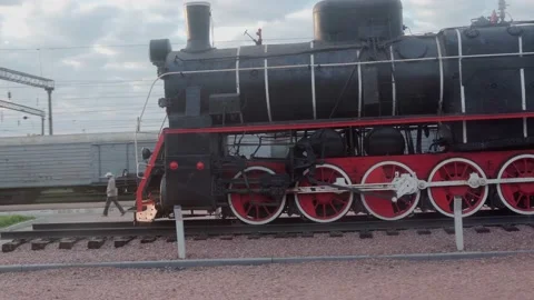 View from window of high-speed train on landscape of old rusty boxcars and high Video stock 159169009