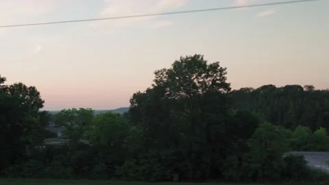View from window high-speed train on landscape of nature field road with car on Stock Footage 159243852