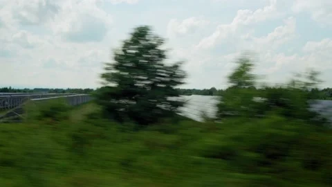 View from window of high-speed train on landscape of beautiful nature wild field Stock Footage 159370510