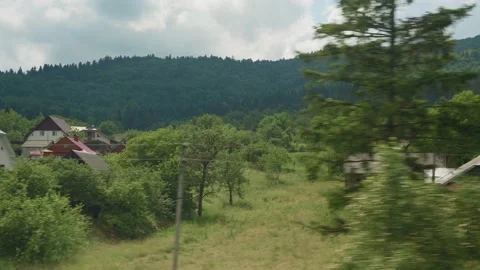 View from window of high-speed train on landscape of beautiful nature wild field Stock Footage 159678022